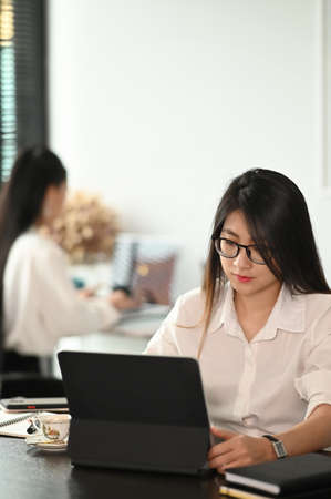 Young business teamwork working with business report on office desk.の写真素材