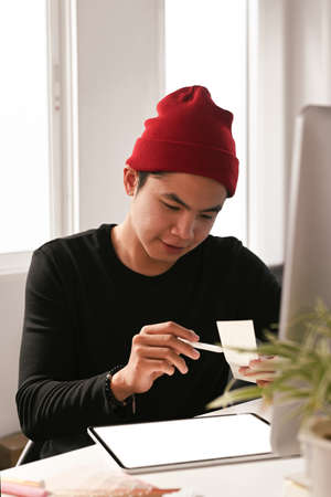 Cropped shot of man secretary checking mail on netbook organizing working process in officeの写真素材