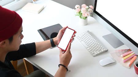 Cropped shot of a businessman is working on computer tablet and checking financial report at the...