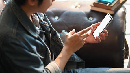 Croped shot young man using digital tablet for planning his strategyのeditorial素材