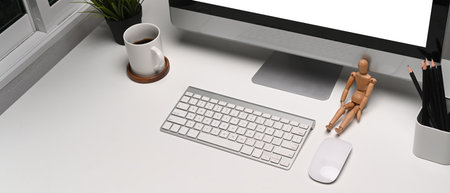 Close up view of man hands working on laptop computer at his workplace. Empty screen for advertise...