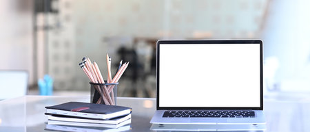 Close up view of female designer holding stylus pen pointing on screen of tablet computer.