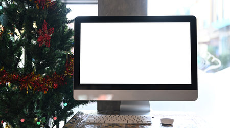 Front view of mock up modern desktop computer with white screen. Blank screen for graphic display...