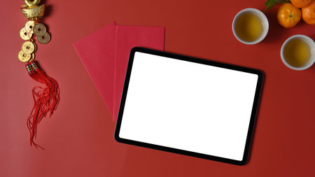 Overhead shot of female freelancer working on laptop computer while sitting on floor at her workplace.の写真素材