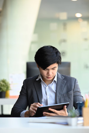 Businesspeople financial experts discussing information during accounting process with modern laptop computer in office.の写真素材