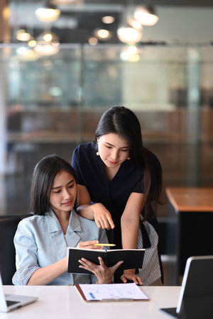 Businesswomen talking of business plan and strategy at meeting room .の写真素材