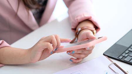 Mock up laptop with blank screen on wooden table in coffee shop.の写真素材