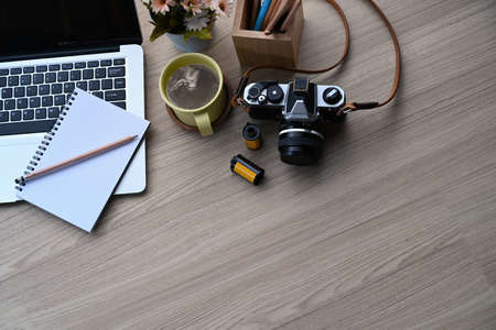 Cropped shot of young female freelance sitting at cafe and using smart phone.の写真素材