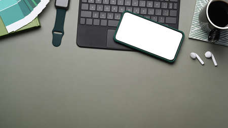 Side view of businesswoman using digital tablet planning her work while sitting at office.