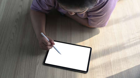 Close up view of obese woman  holding mock up smart phone and siting on sofa.の写真素材