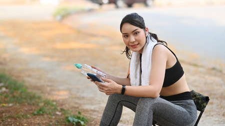 Attractive businesswoman smiling and working with computer laptop at modern office.の写真素材