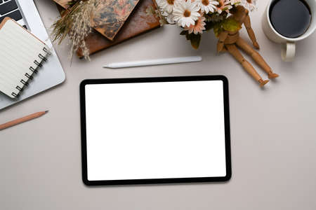 Above view of graphic designer workplace with laptop computer, color swatches, stationery and notebook on marble background.の写真素材