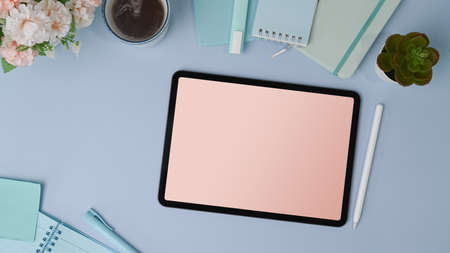 Close up view of graphic designer choosing colors from color swatch samples.
