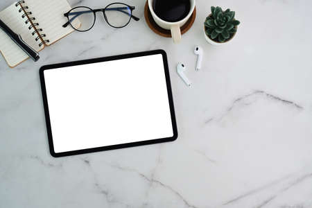 Top view of smart phone, laptop computer, notebook and coffe cup on pink background.