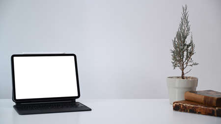Cropped shot of businesswoman workinh with computer tablet and using smer phone searching information.の写真素材