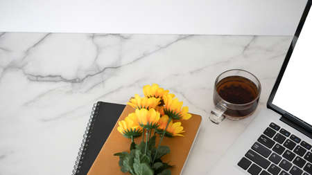 Close up view mock up computer laptop with blank screen on white desk at home office.の写真素材