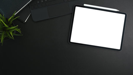 Above view of woman hands typing on keyboard over white office desk.の写真素材