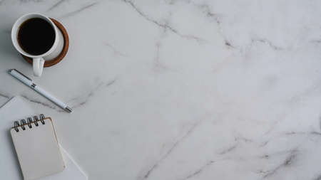 Above view of woman hands typing on keyboard over white office desk.の写真素材