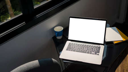 Top view of mock up digital tablet, headphone, coffee cup and plant on yellow background.