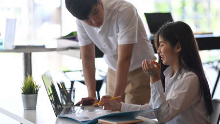 Business team analyzing some document together in office.の写真素材