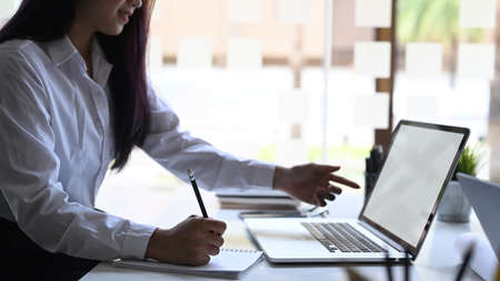 Cropped shot business consulting with paper data on office workplace.
