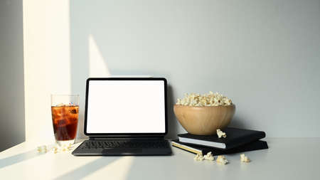 Cropped shot of businesswoman hand holding stylus pen pointing on screen of computer tablet.