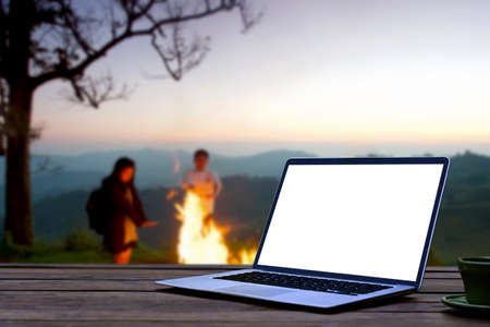 Casual woman sitting on floor in living room and using laptop computer.の写真素材