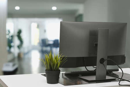 Casual woman sitting on floor in living room and using laptop computer.の写真素材