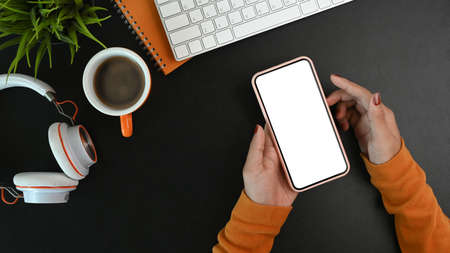 Mock up digital tablet, smart phone, headphone and notebook on brown leather.の写真素材