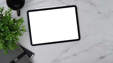 Mock up digital tablet, smart phone, headphone and notebook on brown leather.