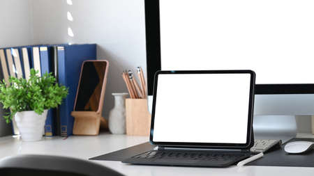 Top view computer laptop, smart phone, coffee cup and notebook on office desk.の写真素材