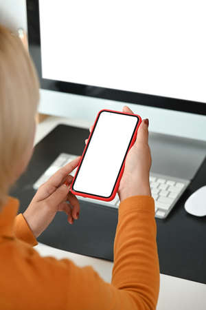Cropped shot of stylish woman hands typing on wireless keyboard of digital tablet.