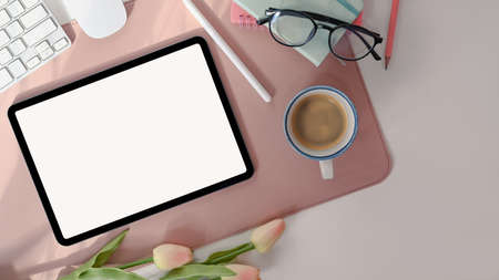 Digital tablet with white screen and stylus pen on female workspace.の写真素材