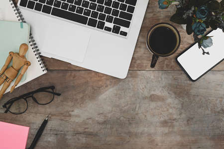 Modern dark workspace with black equipment and copy space on black leather.