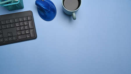 Mock up computer laptop with blank screen and cup of coffee kitchen.の写真素材