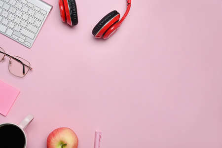 Above view of laptop, smart phone and classical guitar on wooden floor.の写真素材