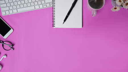 Close up view businesswoman holding mock up mobile phone with lank screen at her workspace.の写真素材