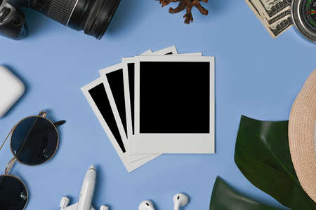 High angle view of simple workspace with smart phone, notebook, sticky note and coffee cup on wooden desk.の写真素材