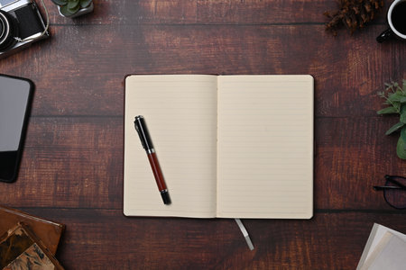 Empty picture frame on wooden background.の写真素材