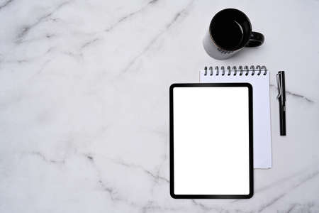 Empty notebook, pen and glasses on beige background.の写真素材