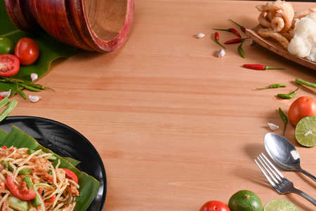 Papaya salad with sticky rice on black plate. Thai food conceptの写真素材