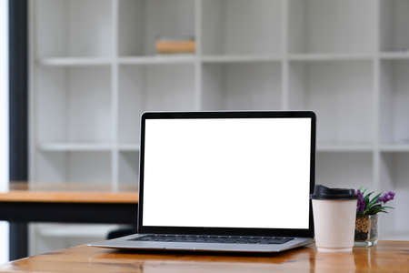 Mock up computer tablet and office supplies on wooden table.の写真素材