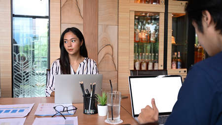 Group of young business people working on new project together in office.