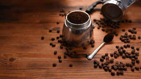 Overhead shot woman making note on notebook and using laptop computer.の写真素材