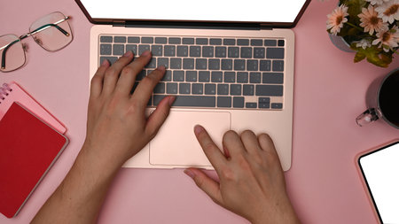 Above view woman making note on notebook at her workspace.の写真素材