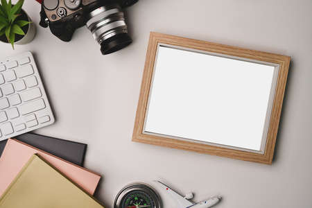 Woman holding mock up mobile phone with empty screen at her workspace.の写真素材