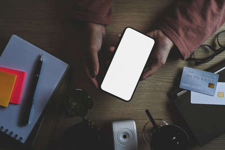 Businessman holding notepad and working with laptop.の写真素材