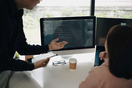 Team of programmers working on new project together in office.の写真素材