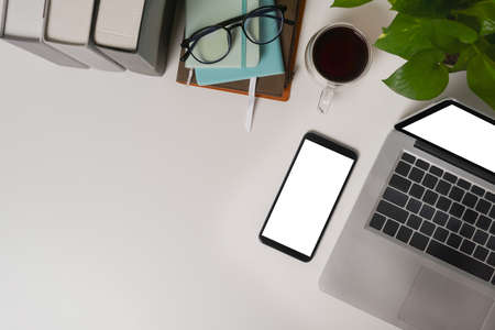 Mock up mobile phone, notebook, glasses and bag on yellow background.の写真素材