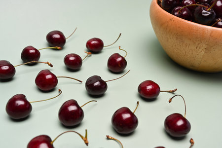 Fresh ripe red cherry on blue background.